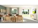 Cozy living room featuring comfortable seating, a large window, and a sliding glass door to the backyard at 11864 Blue Diamond Trl, Parrish, FL 34219