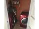 Modern red washer and dryer set in a dedicated laundry room at 1204 23Rd W Ave, Palmetto, FL 34221