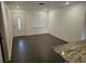 Bright living room with stylish tiled floors and an ornate front door at 1204 23Rd W Ave, Palmetto, FL 34221