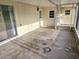 Spacious enclosed patio with access doors, offering an adaptable indoor-outdoor living space at 1204 23Rd W Ave, Palmetto, FL 34221