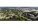 Expansive aerial shot of the neighborhood showcasing homes, green spaces, and proximity to local amenities at 12170 Lake Allen Dr, Largo, FL 33773