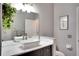 Stylish bathroom with vessel sink, dark wood vanity, and modern fixtures at 12170 Lake Allen Dr, Largo, FL 33773