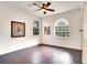 Bedroom with dark hardwood floors and multiple large windows at 12170 Lake Allen Dr, Largo, FL 33773