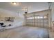 Clean garage space with storage shelves and an automatic door opener at 12170 Lake Allen Dr, Largo, FL 33773