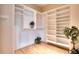 Bright walk-in closet featuring custom shelving and a plant for an airy touch at 12170 Lake Allen Dr, Largo, FL 33773