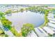 Aerial view of the lake surrounded by residences within the community showing the abundance of green space at 12501 Ulmerton Rd # 14, Largo, FL 33774