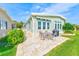 A well kept outdoor patio featuring a table and chairs perfect for outdoor living and entertaining at 12501 Ulmerton Rd # 14, Largo, FL 33774