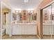 Bright bathroom with double sinks, tile flooring, and ample counter space at 12501 Ulmerton Rd # 14, Largo, FL 33774