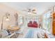 Bright bonus room with tile flooring, dining table, and a comfortable seating area at 12501 Ulmerton Rd # 14, Largo, FL 33774