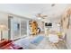 Cozy bonus room with tile floors, desk area, and access to the outdoor patio at 12501 Ulmerton Rd # 14, Largo, FL 33774
