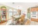 Dining area with natural light offering a lovely view and stylish furnishings at 12501 Ulmerton Rd # 14, Largo, FL 33774