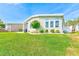 Well-maintained home with a large green lawn, ideal for outdoor activities and relaxation at 12501 Ulmerton Rd # 14, Largo, FL 33774
