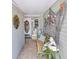 Welcoming front porch with coastal decor, including nautical accents and comfortable seating at 12501 Ulmerton Rd # 14, Largo, FL 33774