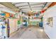 Organized garage space featuring shelves, cabinets, a work sink, and ample storage for various household items at 12501 Ulmerton Rd # 14, Largo, FL 33774