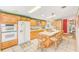Spacious kitchen features an island with seating and ample cabinet space at 12501 Ulmerton Rd # 14, Largo, FL 33774