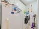Practical laundry area with modern washer and dryer and additional storage space at 12501 Ulmerton Rd # 14, Largo, FL 33774