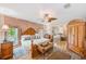 Spacious main bedroom with hardwood floors, large bed, and ample closet space at 12501 Ulmerton Rd # 14, Largo, FL 33774