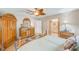 Comfortable main bedroom with hardwood floors and decorative wooden furniture at 12501 Ulmerton Rd # 14, Largo, FL 33774