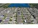 An aerial view showcasing a well-planned community with lush landscaping near a serene lake at 12618 Sandpine Reserve Pl, Gibsonton, FL 33534