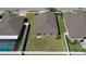 Aerial view of a home highlighting the large, fenced backyard perfect for outdoor activities at 12618 Sandpine Reserve Pl, Gibsonton, FL 33534