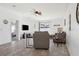Bright living room featuring tile floors, ceiling fan, and comfortable seating at 12618 Sandpine Reserve Pl, Gibsonton, FL 33534