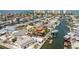 Aerial view of waterfront homes along canals and a view of the ocean at 13514 Garris Dr, Hudson, FL 34667