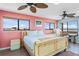 Cozy bedroom with large windows offering panoramic views and a relaxing atmosphere at 13514 Garris Dr, Hudson, FL 34667