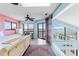 Comfortable bedroom with beautiful water views, a ceiling fan and lots of natural light at 13514 Garris Dr, Hudson, FL 34667