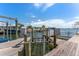 Boat lift and dock on the water offering easy access for boating and watersports at 13514 Garris Dr, Hudson, FL 34667
