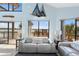 Bright living room with comfortable seating, large windows and views of the water at 13514 Garris Dr, Hudson, FL 34667
