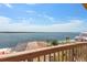 Enjoy the panoramic water views from this charming home, complete with a private balcony at 13514 Garris Dr, Hudson, FL 34667