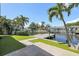 Waterfront backyard features artificial turf, a dock, and easy access to the canal at 1361 46Th Ne Ave, St Petersburg, FL 33703