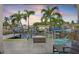 Backyard with palm trees, waterfront views, outdoor seating, and a cozy fire pit at 1361 46Th Ne Ave, St Petersburg, FL 33703