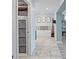 Bright bathroom offers a free-standing tub, modern fixtures, and decorative artwork at 1361 46Th Ne Ave, St Petersburg, FL 33703