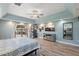 Spacious main bedroom boasts water views, wood floors, tray ceiling, and an entertainment area at 1361 46Th Ne Ave, St Petersburg, FL 33703