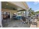 Covered outdoor space with lounge seating, water views, and an outdoor dining area at 1361 46Th Ne Ave, St Petersburg, FL 33703