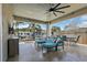 Relaxing covered patio area featuring comfortable lounge seating and canal views at 1361 46Th Ne Ave, St Petersburg, FL 33703