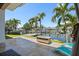 A waterfront patio showcasing outdoor furniture with views of the canal at 1361 46Th Ne Ave, St Petersburg, FL 33703