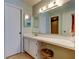 Bathroom features a vanity with mirror and decorative light fixture at 14130 Rosemary Ln # 3312, Largo, FL 33774