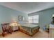 Cozy bedroom boasts soft lighting, plush carpet, and ample space for relaxation at 14130 Rosemary Ln # 3312, Largo, FL 33774