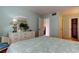 Bright bedroom features light-colored walls, ensuite access, and a spacious closet at 14130 Rosemary Ln # 3312, Largo, FL 33774