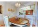 Cozy dining area with chandelier open to kitchen and living room, great for entertaining at 14130 Rosemary Ln # 3312, Largo, FL 33774