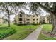 Well-maintained condo building with lush landscaping, offering serene community living at 14130 Rosemary Ln # 3312, Largo, FL 33774