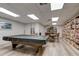 Large game room featuring a pool table, a library, and a cozy seating area at 14130 Rosemary Ln # 3312, Largo, FL 33774