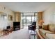 Inviting living room boasts comfortable seating, neutral carpet, and large windows at 14130 Rosemary Ln # 3312, Largo, FL 33774