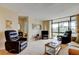 Bright living room featuring recliners, large windows, and lots of natural light at 14130 Rosemary Ln # 3312, Largo, FL 33774