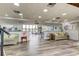 Spacious lobby with comfortable seating, wood-look floors, and natural light at 14130 Rosemary Ln # 3312, Largo, FL 33774