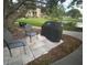 Outdoor grilling area with seating, perfect for cookouts near the lake at 14130 Rosemary Ln # 3312, Largo, FL 33774