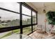 Covered patio with views of the lush greenery, tile floors, and cozy seating at 14130 Rosemary Ln # 3312, Largo, FL 33774