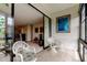 Relaxing patio with tile floors, comfortable seating, and sliding glass doors to the living room at 14130 Rosemary Ln # 3312, Largo, FL 33774
